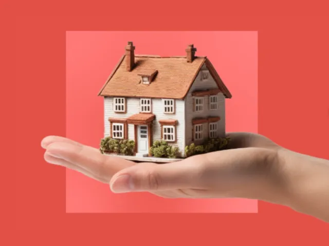 Maison dans une paume d'une main.